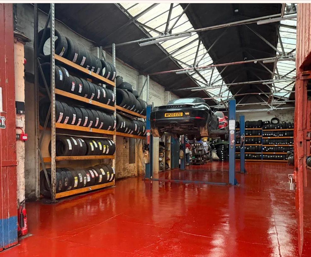 B1 Autos workshop with tyre racks and vehicle lift