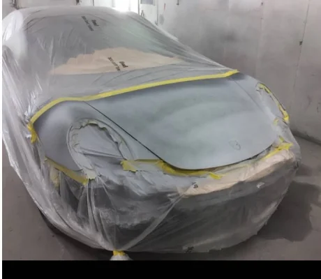 Car front end masked for panel preparation