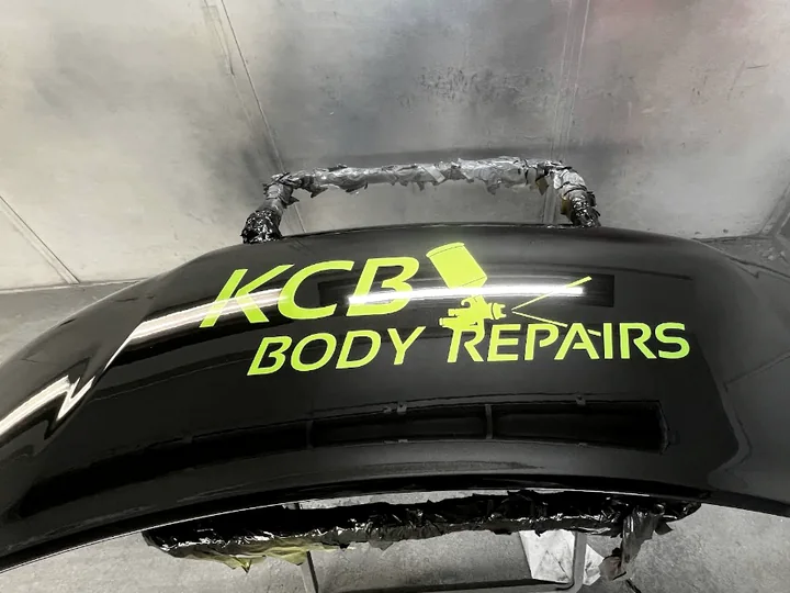 Close-up of finished black automotive bodywork