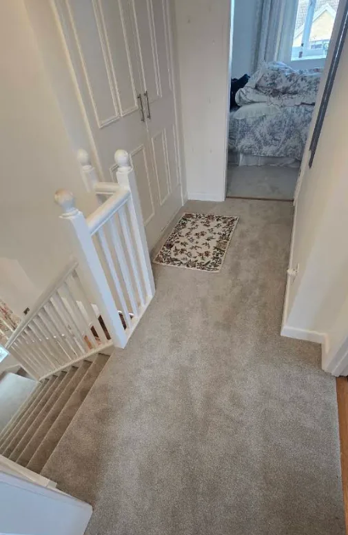 Landing and stairs with new grey carpet